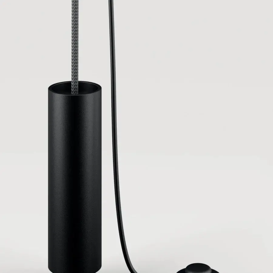 Elegant Lodes Cima lamp with a cylindrical matte black body suspended by a sophisticated gray braided rope