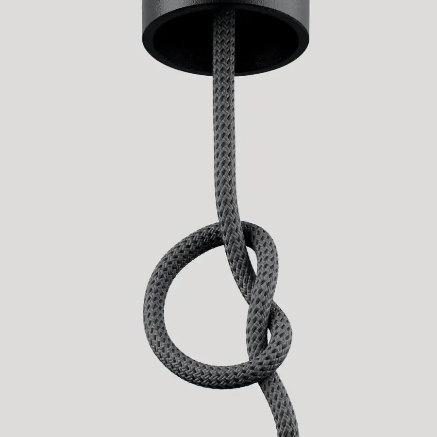 Exceptional Lodes Cima lamp with cylindrical matte black metal body suspended by braided gray rope and counterweight