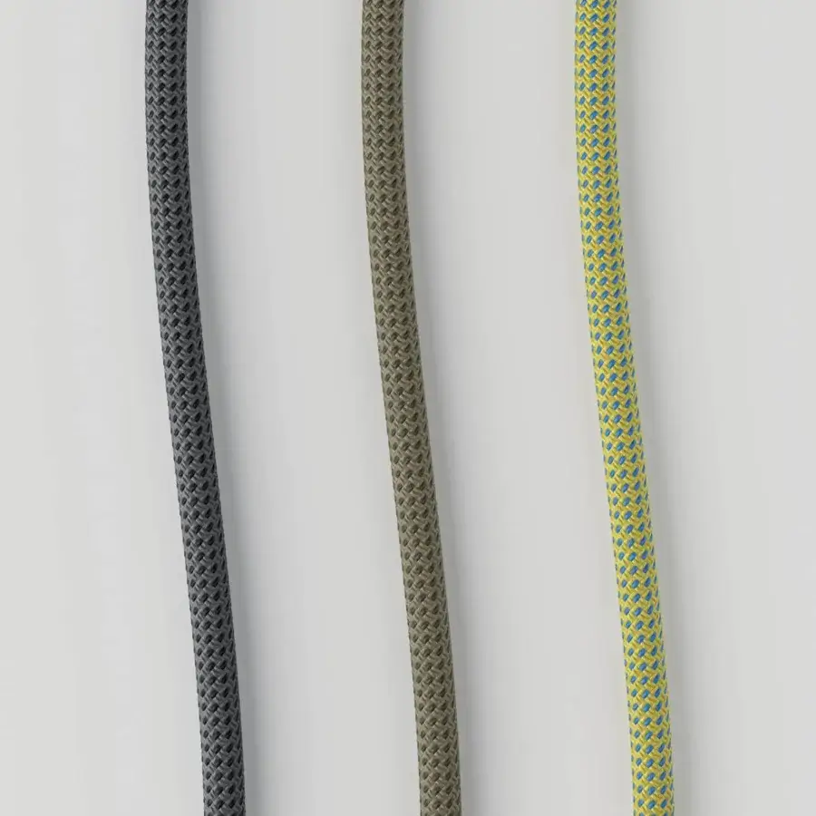 Distinguished Lodes Cima lamp with vibrant yellow rope and subtle blue accents woven with cylindrical metal hardware