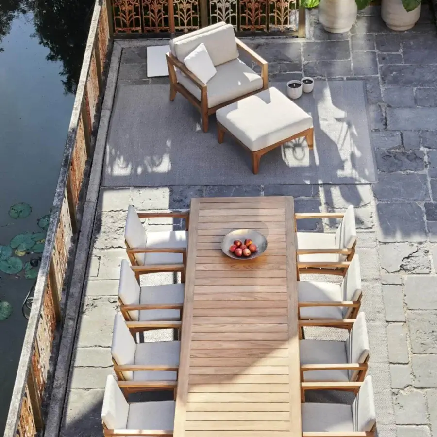 Superior Royal Botania U-nite table crafted in teak with a smooth finish and parallel slat tabletop exhibiting natural wood grain