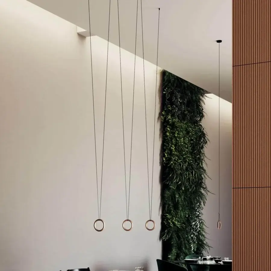 Elegant Lodes IVY V suspension lamp crafted in copper or bronze with a smooth metallic finish and slender dark cables