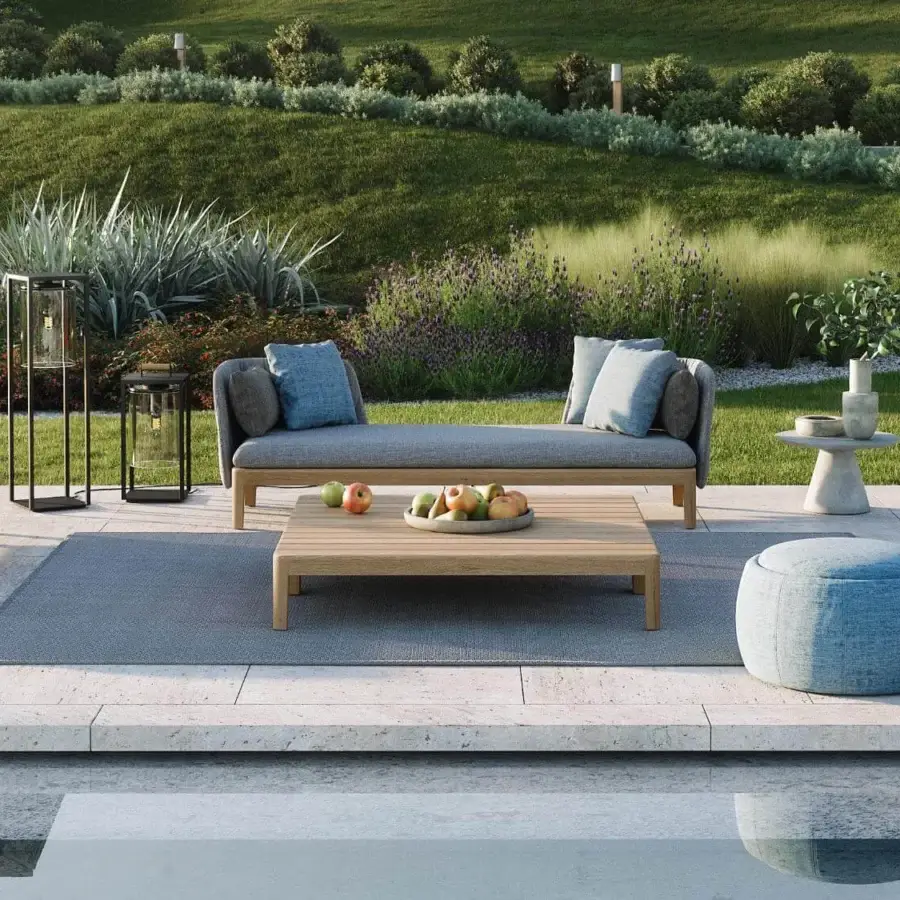 Exceptional Royal Botania Calypso sectional with teak base, stainless steel backrests and muted blue upholstery