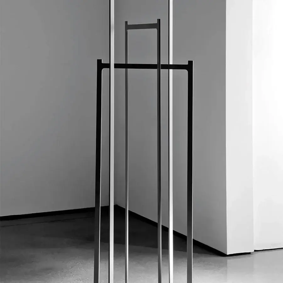 Elegant Sovet Italia Clip coat stand in laser-cut welded metal with a black embossed finish presents a geometric silhouette