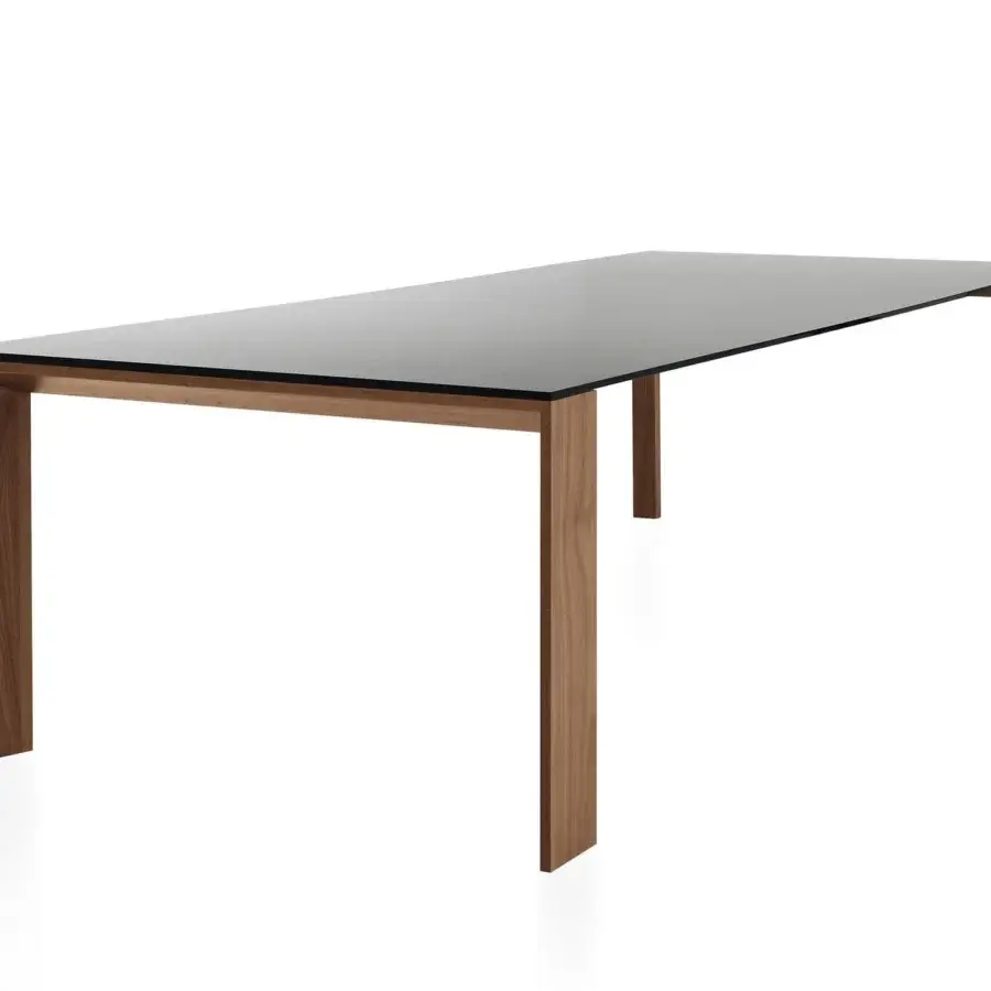 Distinguished Sovet Italia Toronto table with dark glass and Wengè-stained oak, built with a sleek silhouette and signature “V” profile legs