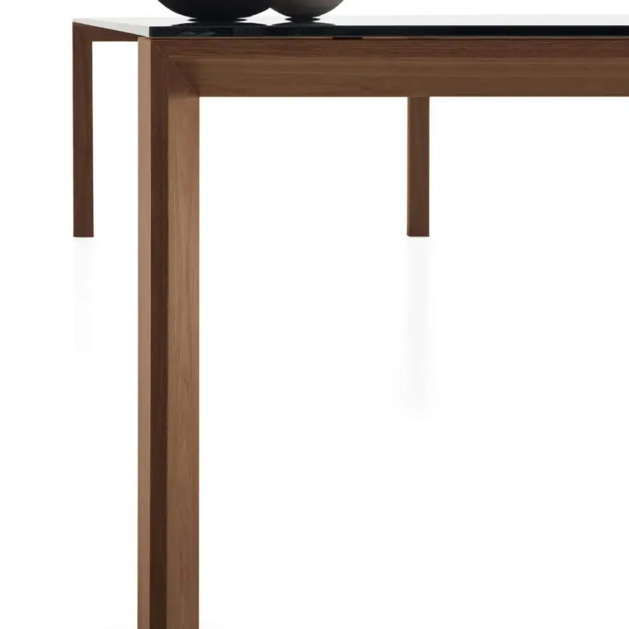 Captivating Sovet Italia Toronto table with Wengè-stained oak legs supporting a dark glass tabletop, built with geometric lines