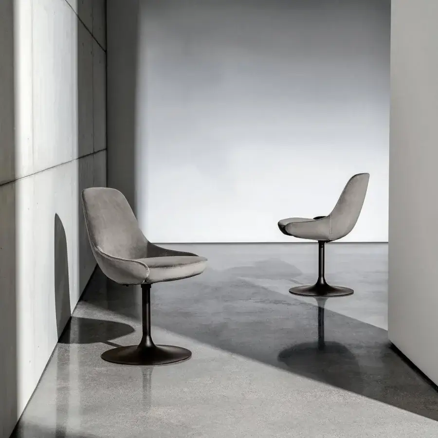 Superior Sovet Italia Cadira chair upholstered in muted gray textile with embossed black lacquered metal base