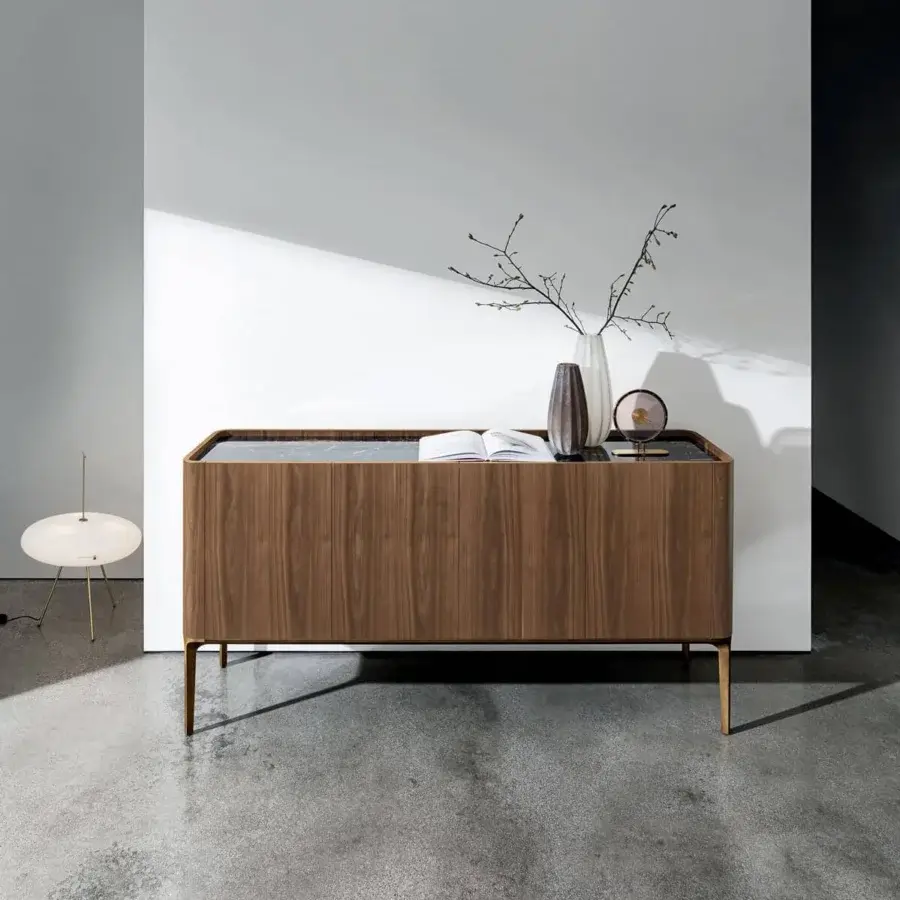 Distinguished Sovet Italia Madia Slim sideboard with veneered Canaletto walnut and ceramic top, built with a brass finished aluminum base