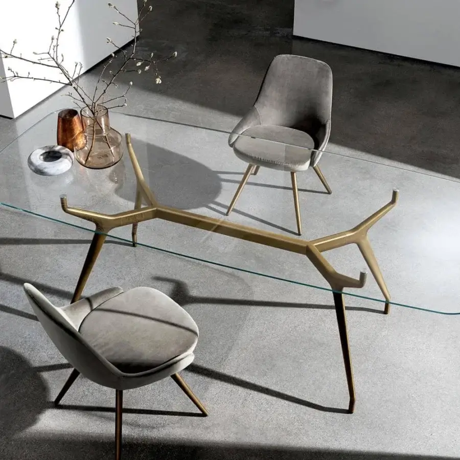 Exceptional Sovet Italia Arkos table with a refined glass top and textured matte bronze die-cast aluminum legs