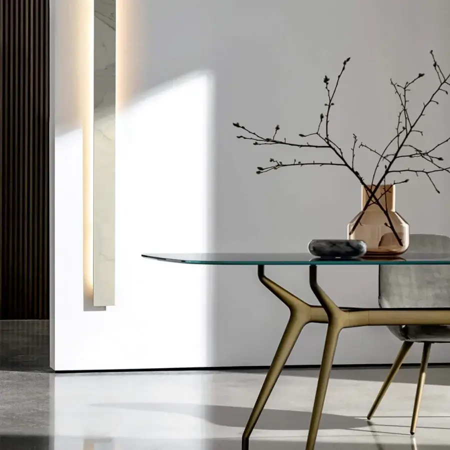 Superior Sovet Italia Arkos table with a rectangular glass top and golden finished aluminum die-casting X legs