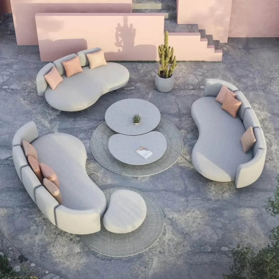 Distinguished Royal Botania Organix lounge coffee table with curved ceramic top and uniquely shaped aluminum base in a matte light gray finish