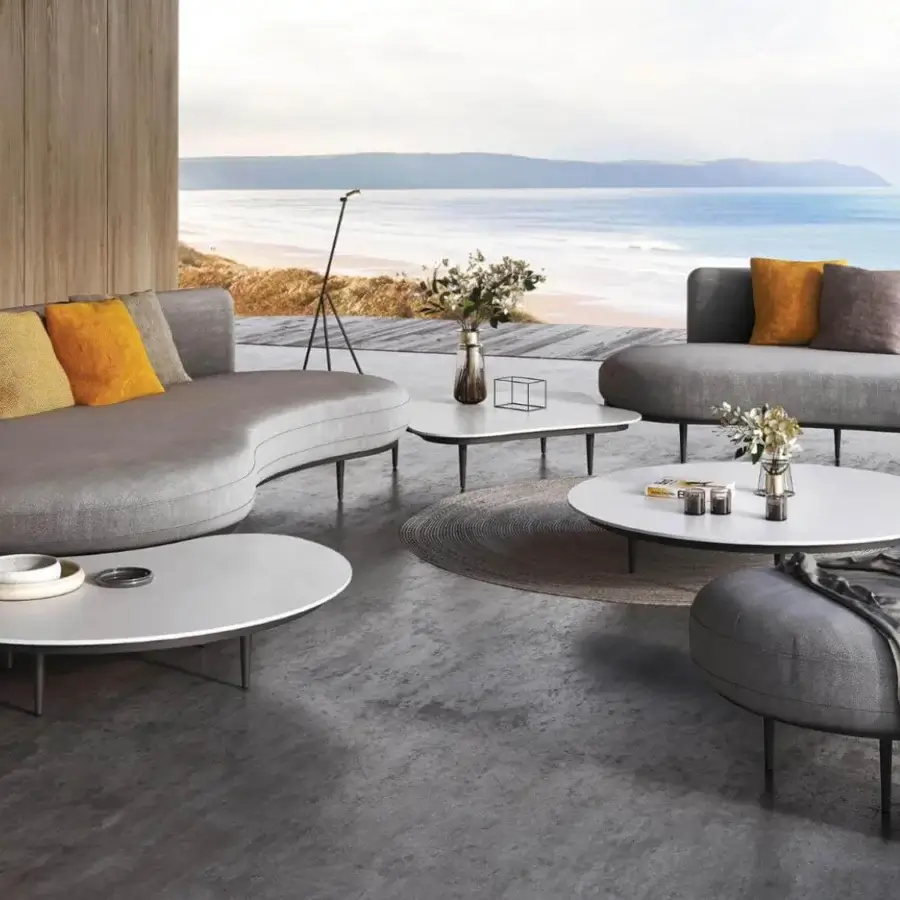 Elegant Royal Botania Organix lounge coffee table with shaped aluminum base and smooth ceramic top in matte white finish