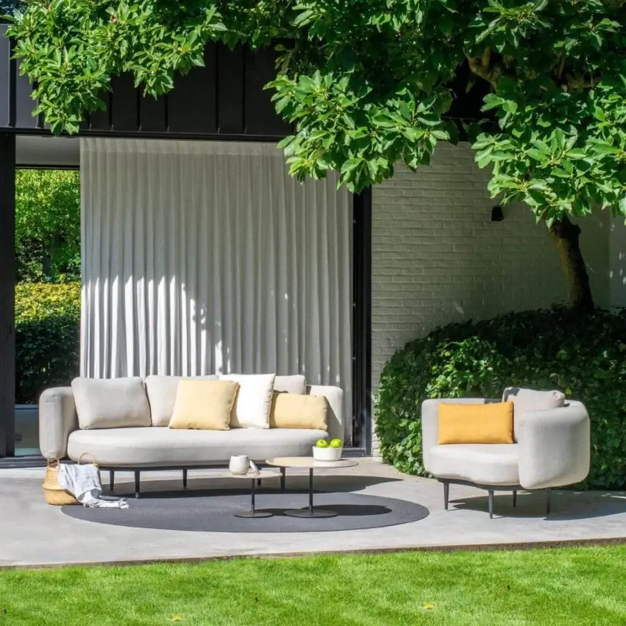 Distinguished Royal Botania Organix Lounge sofa with a light gray textile, vibrant cushions and a dark metal base