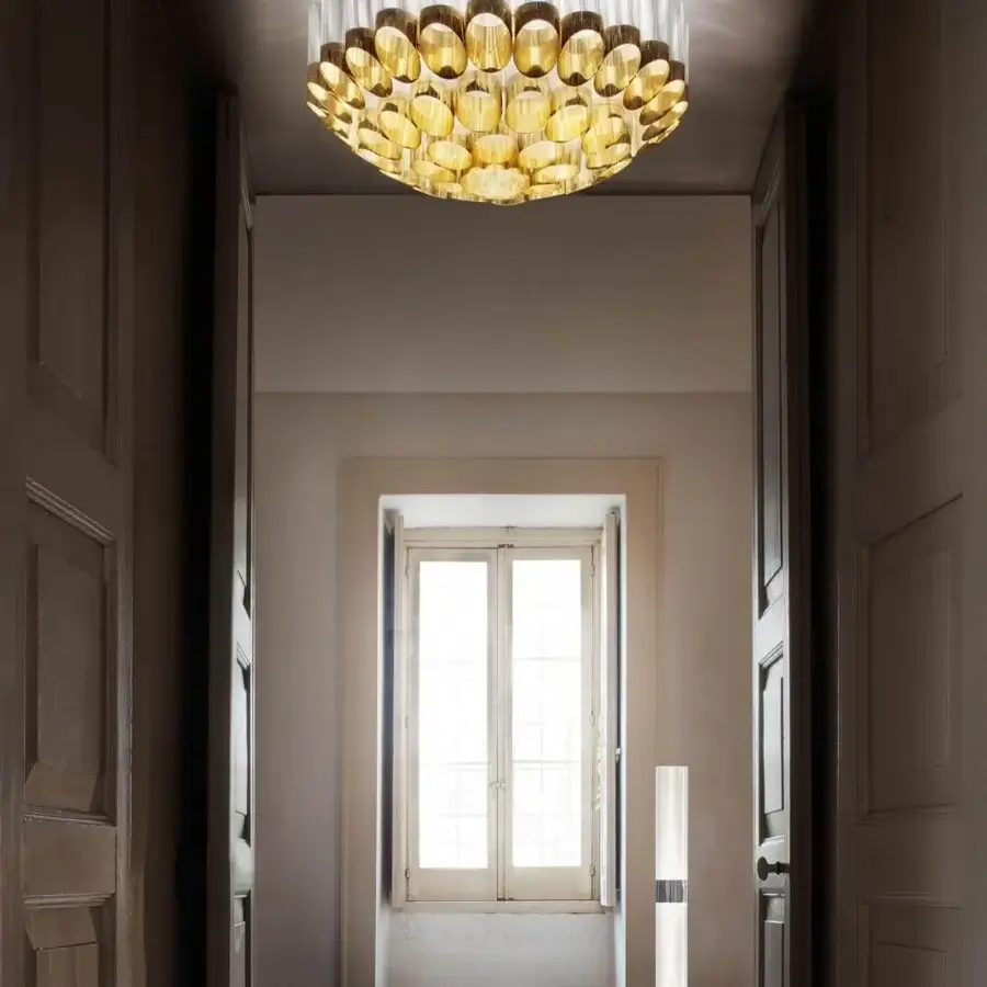 Exquisite Slamp Odeon ceiling lamp with concentric crowns of metallic Lentiflex and Goldflex in gold finish crafted in Italy