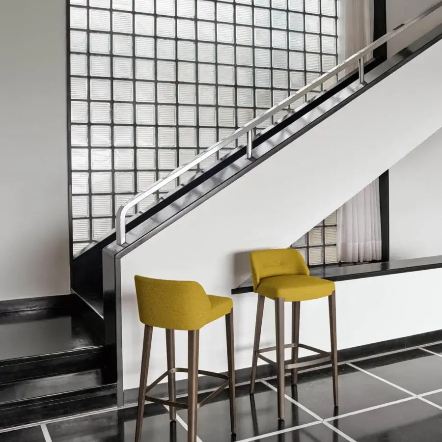 Superior Potocco Concha stool with muted yellow textile and solid oak legs crafted with a smooth finish