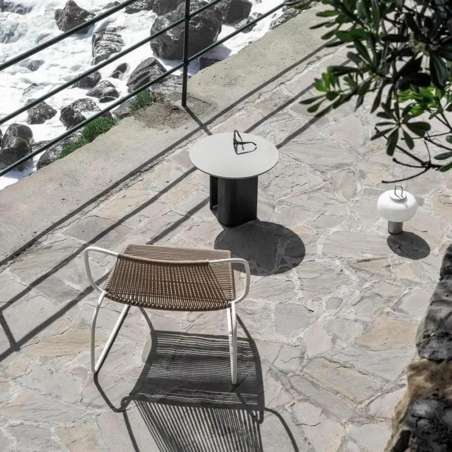 Elegant Potocco Double L side table with natural stone top and embossed black powder coated steel base