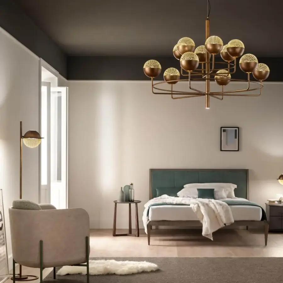 Elegant Masiero Iglù table lamp with brushed patina metal and matt gold metal mesh diffuser showcasing a geometric pattern