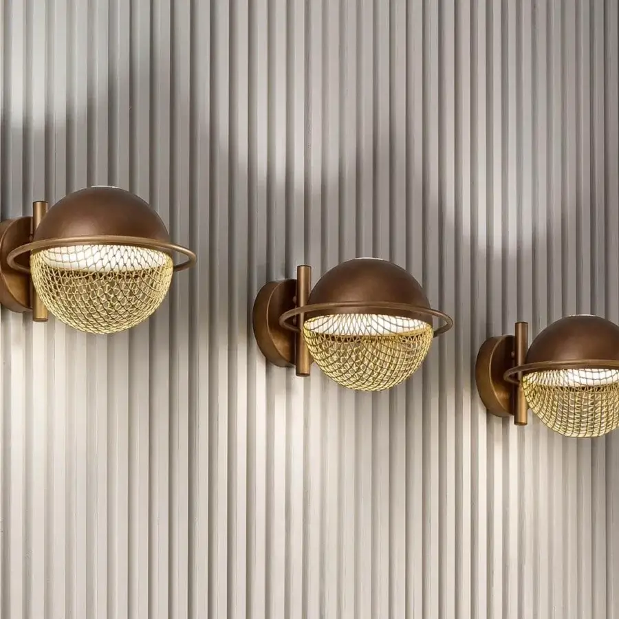 Distinguished Masiero Iglù wall lamp with spherical design crafted in brushed patina bronze and matt gold metal mesh diffuser