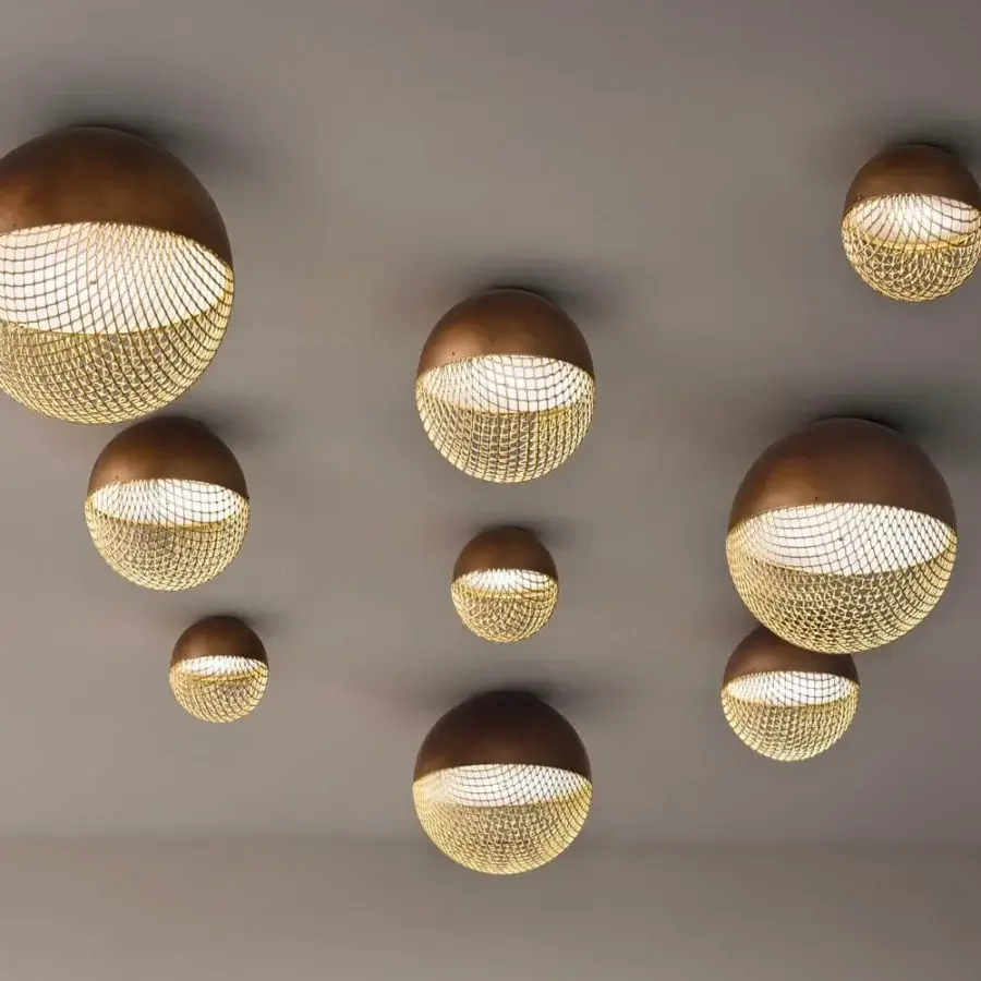 Elegant Masiero Iglù ceiling lamp with bronze and gold spheres affixed to a brushed patina metal mesh diffuser in matt gold