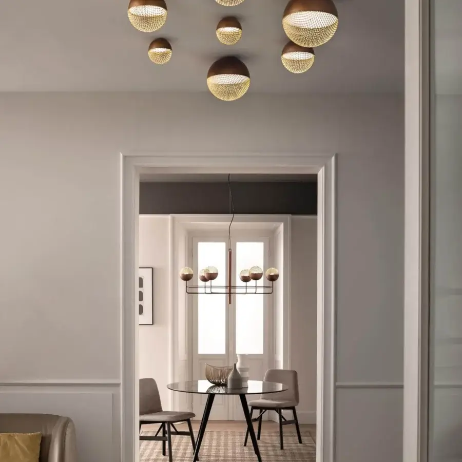 Distinguished Masiero Iglù ceiling lamp with a dark bronze metal structure and refined matt gold metal mesh diffuser