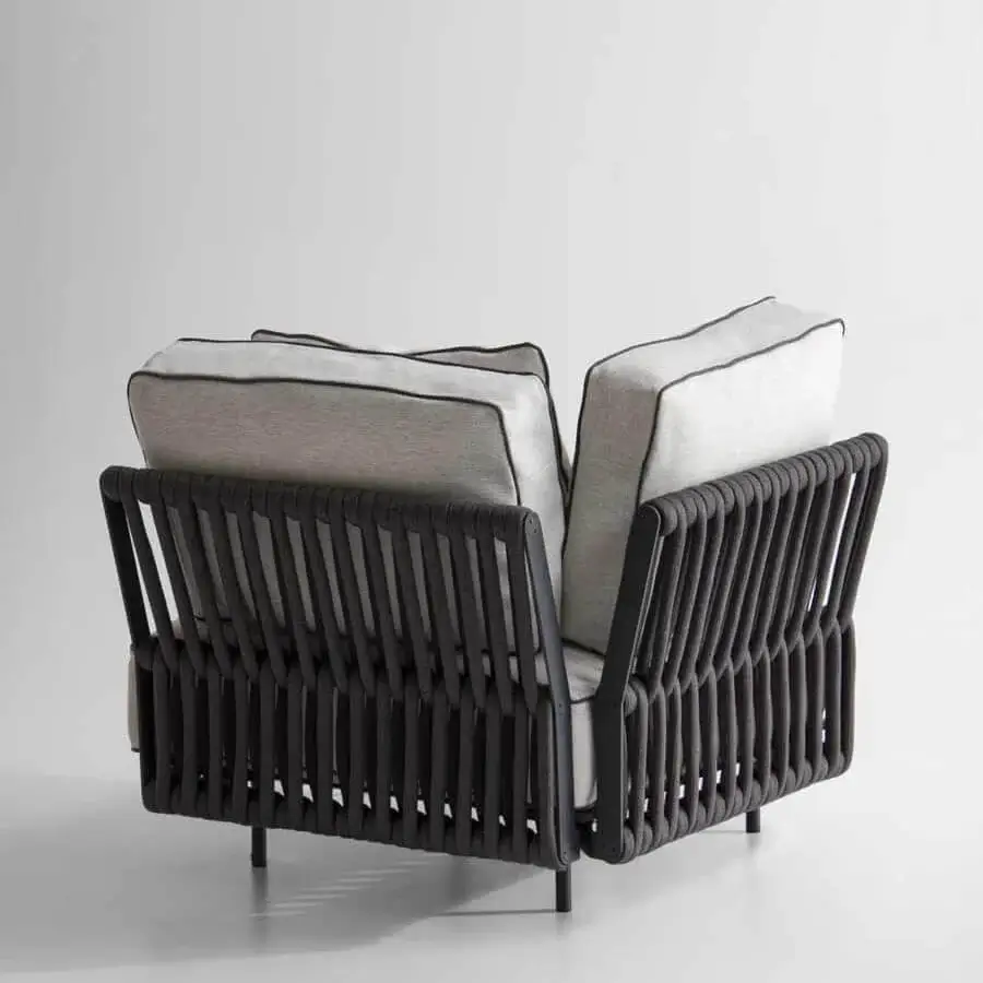 Superior Potocco Soul lounge chair with interwoven dark material, light gray cushions and dark legs