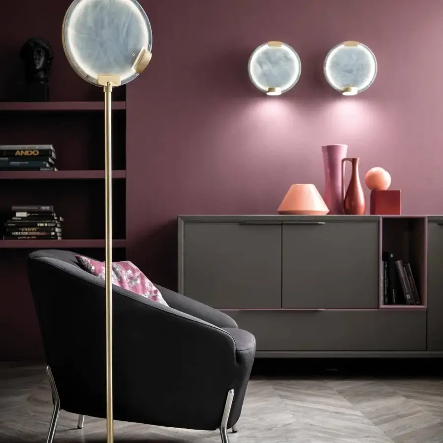 Distinguished Masiero Horo wall lamp with marbled white and grey face framed by gold accents and a glass diffuser