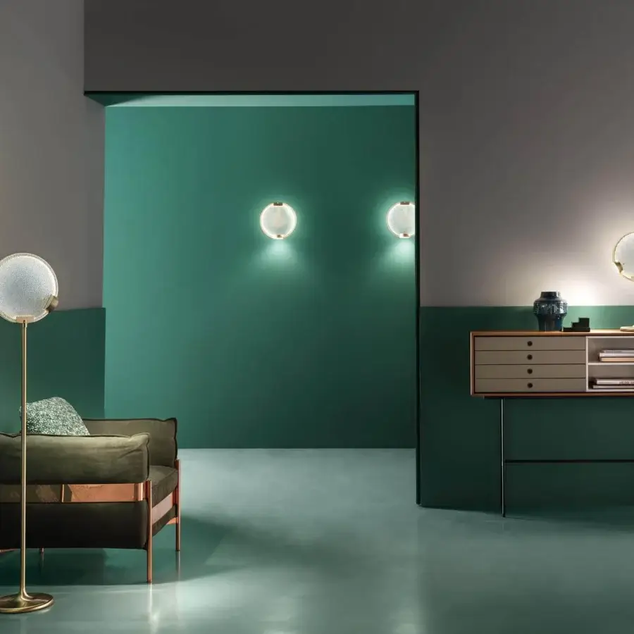 Exceptional Masiero Horo floor lamp with a golden metal structure and refined glass diffuser emitting a soft ambient glow