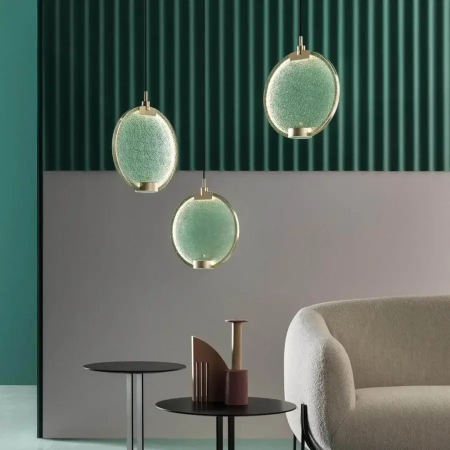 Superior Masiero Horo suspension lamp with pale green glass encased in a glossy golden finish metal structure