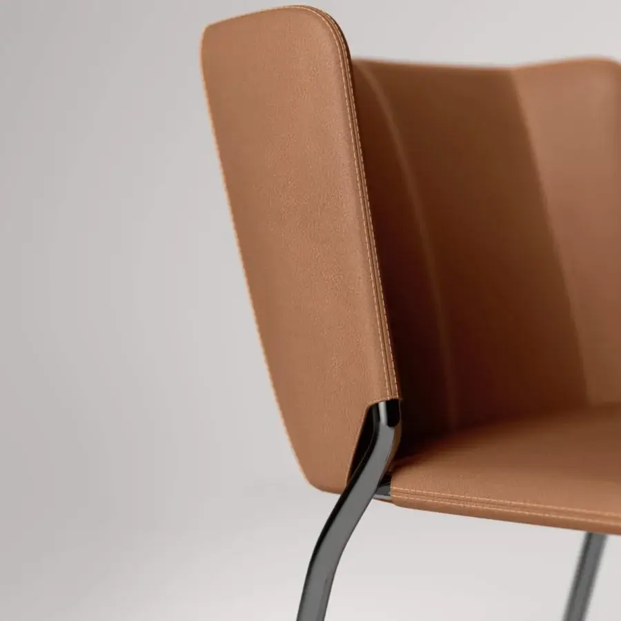 Lavish Tonelli Design She chair with light brown leather upholstery and dark bent metal framing