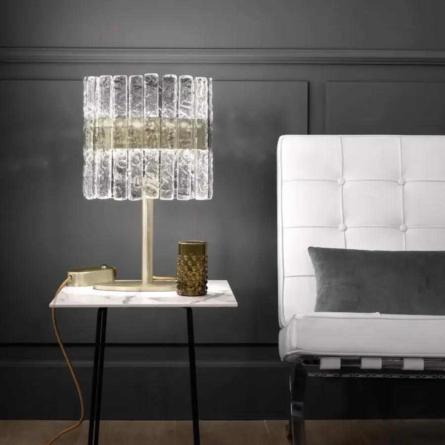 Elegant Masiero Vegas table lamp with a metal structure and rock-effect glass strips in golden hues