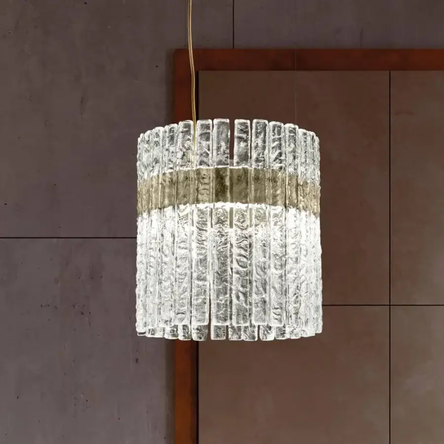 Elegant Masiero Vegas suspension lamp with a metal structure and rock-effect glass strips encircled in golden-colored metal