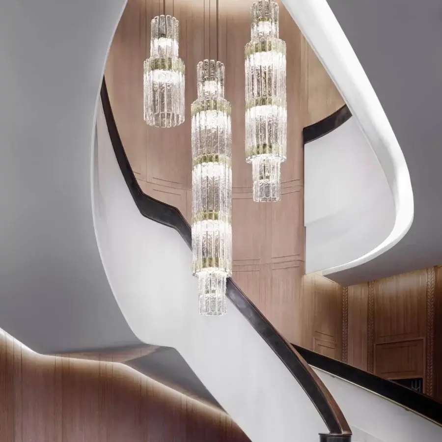 Innovative Masiero Vegas VRT suspension lamp with vertically stacked glass strips and glossy gold-toned metal components