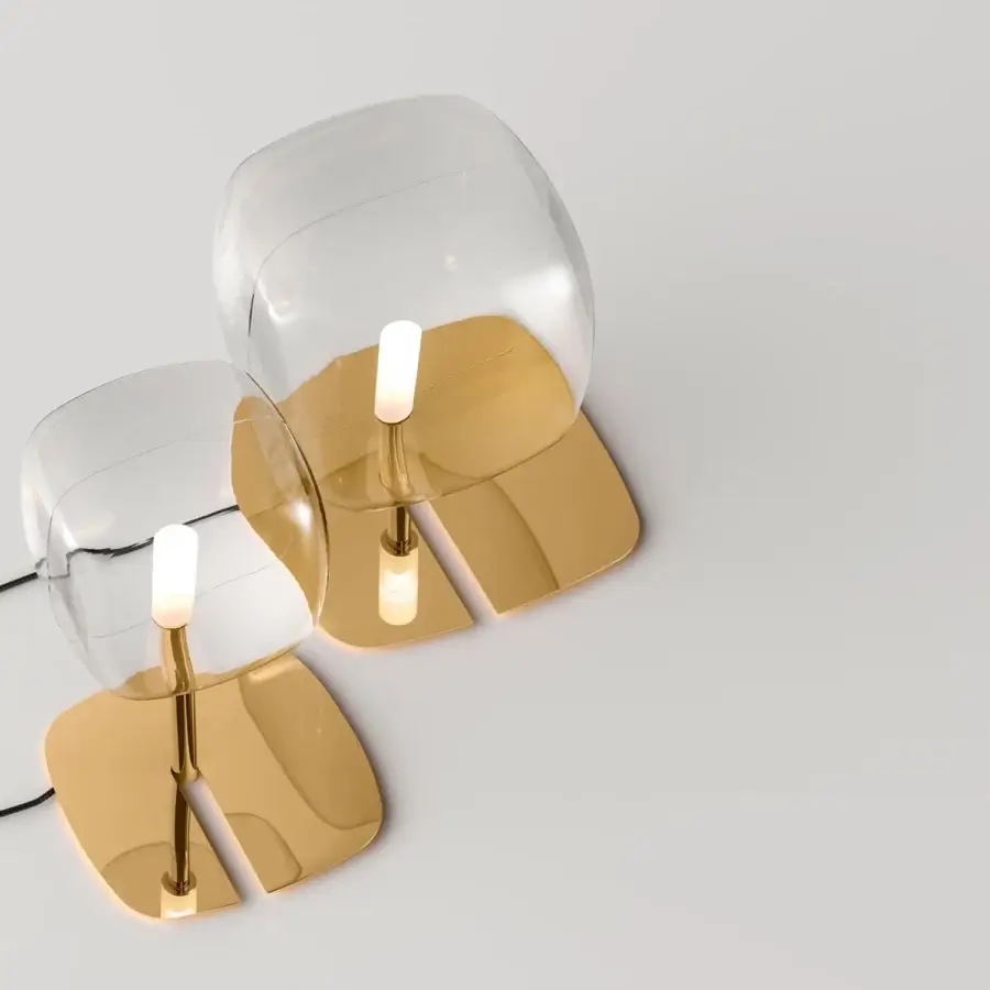 Distinguished Tonelli Design Hyperion lamp with transparent blown pyrex glass diffuser and reflective golden metallic structure