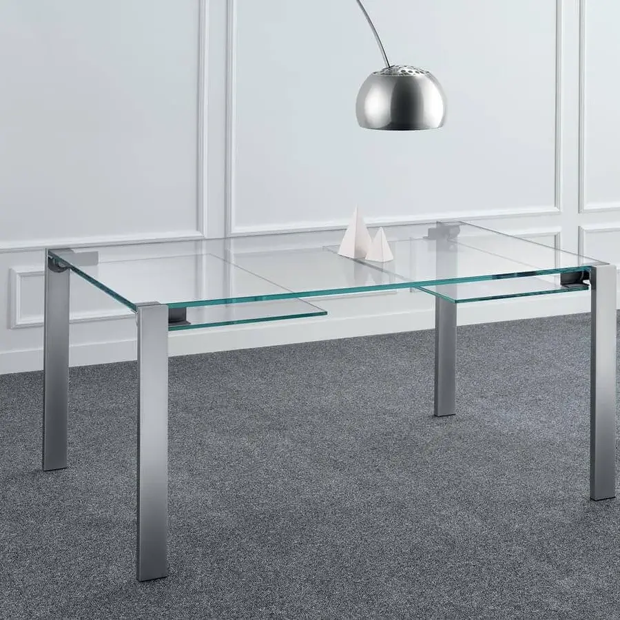 Innovative Tonelli Design Livingstone table with glass top and metal legs in matte finish, extending asymmetrically