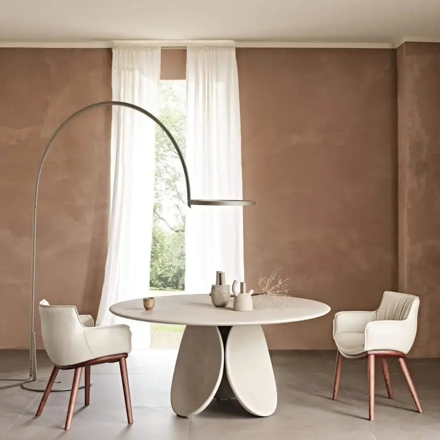 Distinguished Cattelan Italia Rhonda Wood armchair in light cream soft leather with a natural wood base and gently enveloping curves