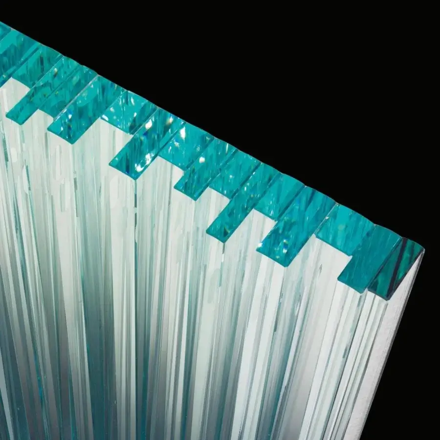 Innovative Tonelli Design Vu mirror with arranged extra clear glass elements and turquoise tops creating a textured effect