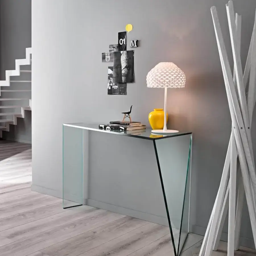 Distinguished Tonelli Design Penrose console crafted in clear glass with an original asymmetrical shape and finely finished oblique cuts