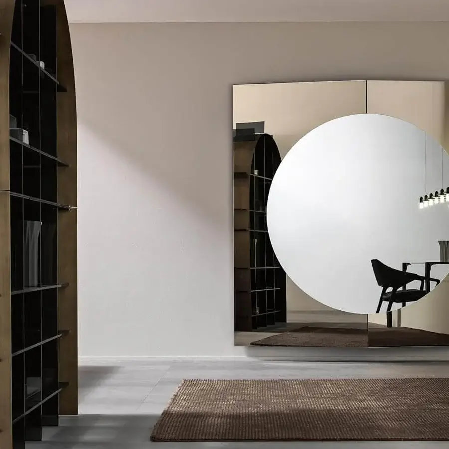 Refined Tonelli Design Central mirror with geometric panels and reflective silver surfaces in a light tan frame