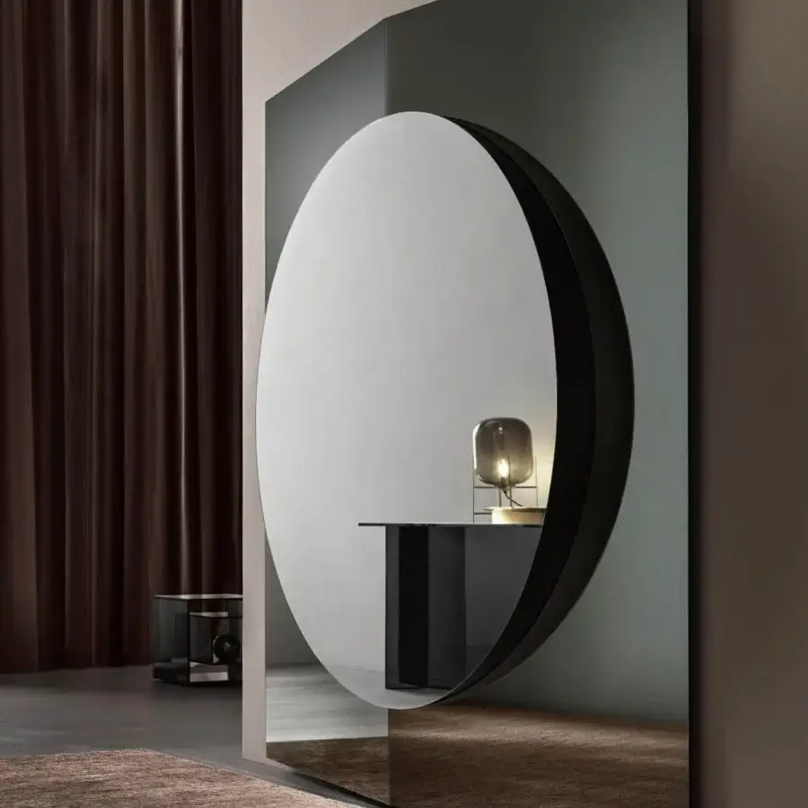 Superior Tonelli Design Central mirror with a dark gray rectangular frame housing a circular reflective surface