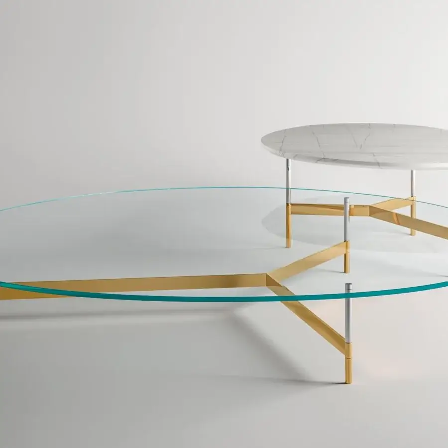 Sophisticated Tonelli Design After9 coffee table with transparent glass and a turquoise edge supported by gold to silver legs