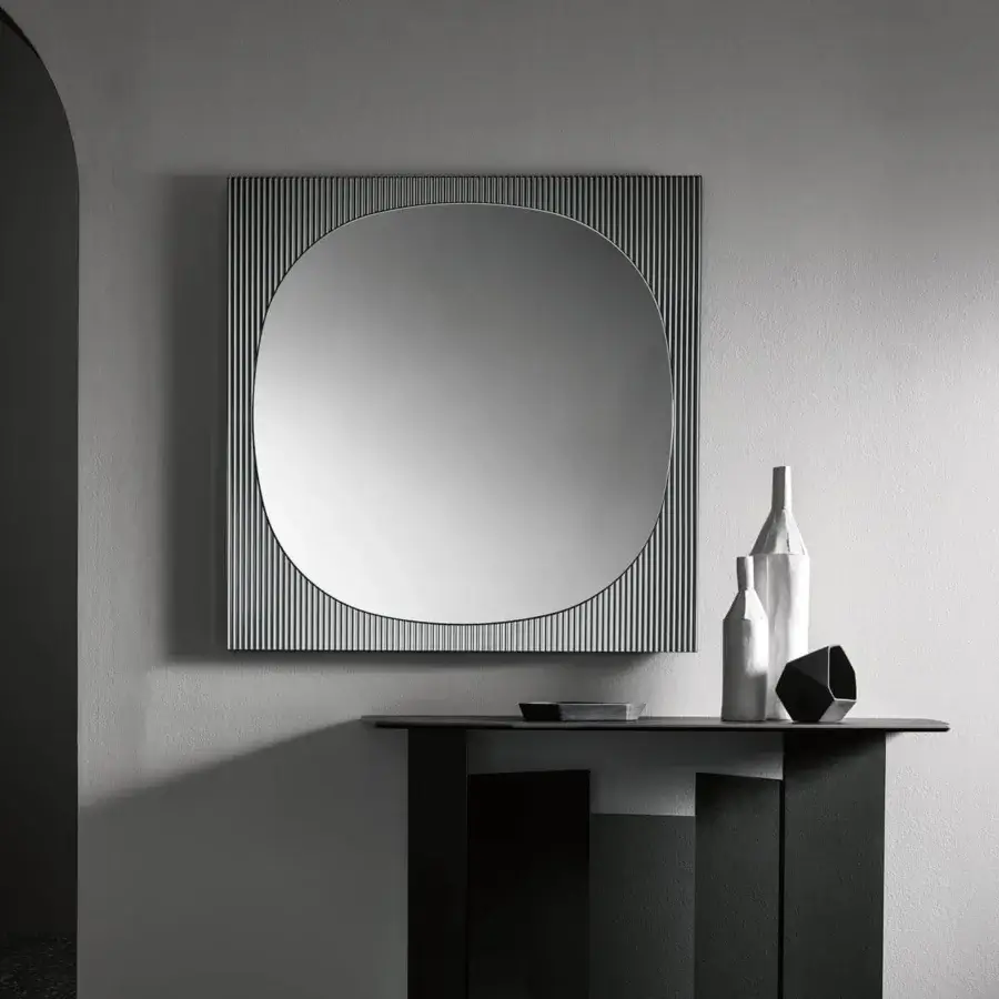 Architectural Tonelli Design Metropolis console with a dark matte rectangular top and sculptural vertically welded glass base