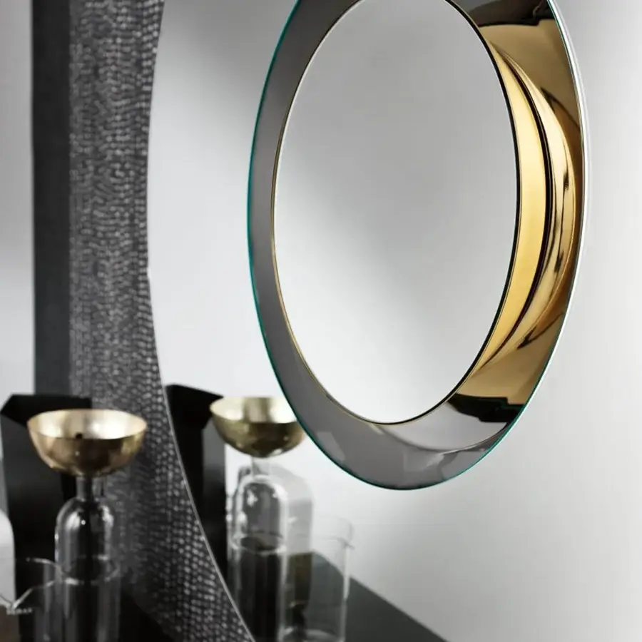 Superior Tonelli Design Ozma mirror with circular silhouette and gilded metal accents in light green with black painted wood