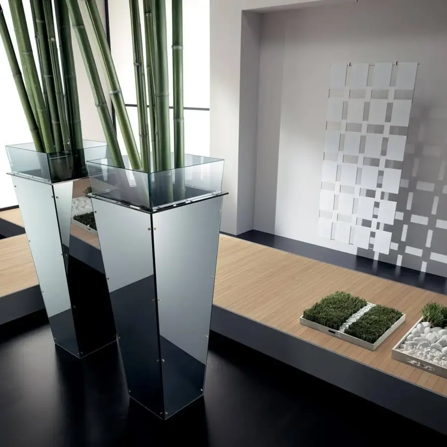 Distinguished Tonelli Design Amon planter with mirrored pedestal and transparent glass top showcasing stainless steel hardware