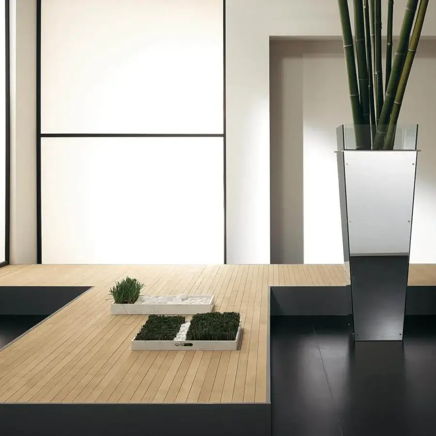 Superior Tonelli Design Amon planter with geometric silhouette built in reflective mirror and visible stainless steel screws