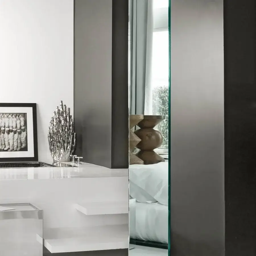 Exceptional Tonelli Design Soglia mirror with revolving glass base and subtly green-tinted glass edges
