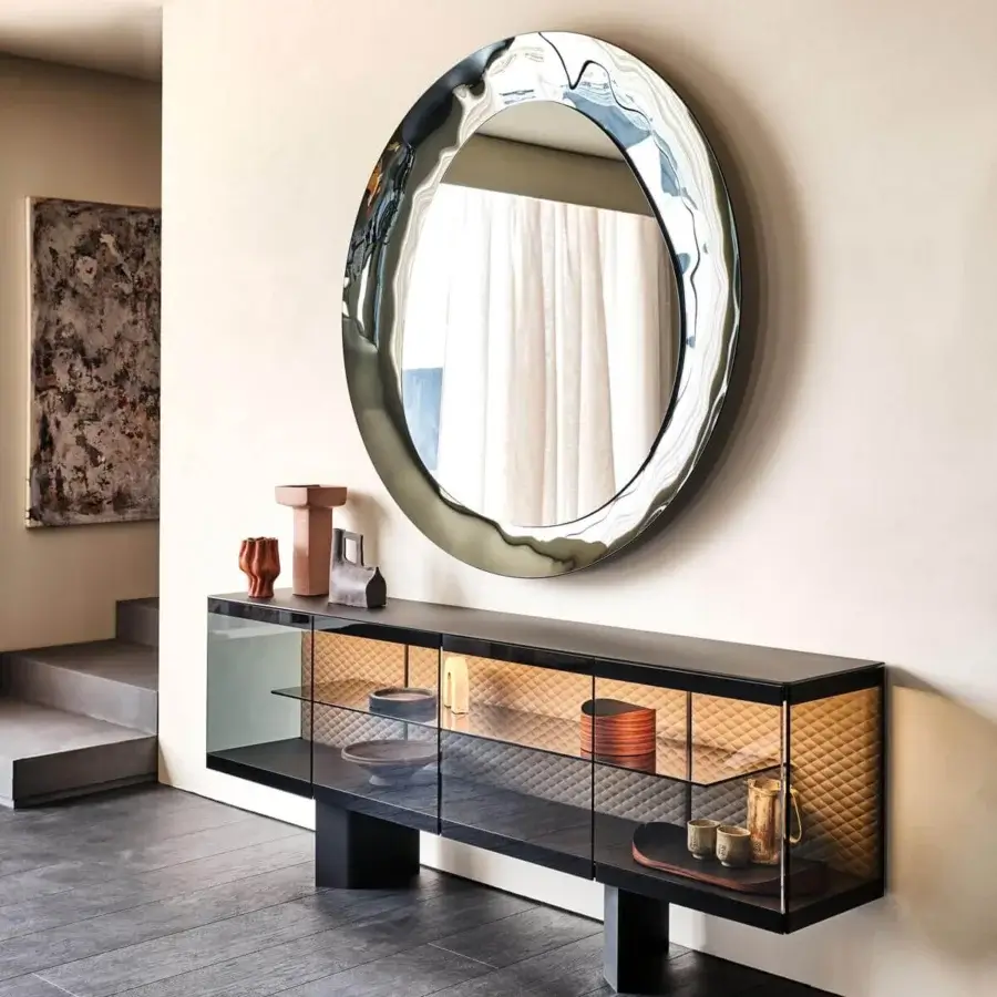 Distinguished Cattelan Italia Cosmos mirror with fumé mirrored glass and organically shaped portions exhibiting a bush-hammered finish