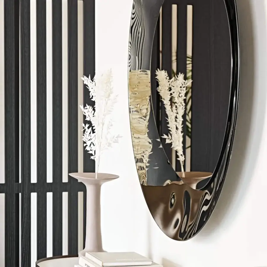Exceptional Cattelan Italia Cosmos mirror with organic contours in bush-hammered bronze mirrored glass and flowing dark frame
