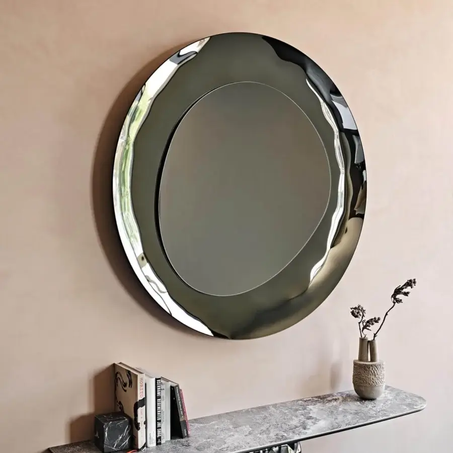 Elegant Cattelan Italia Cosmos mirror with a fluid shape in bronze mirrored glass and bush-hammered finish