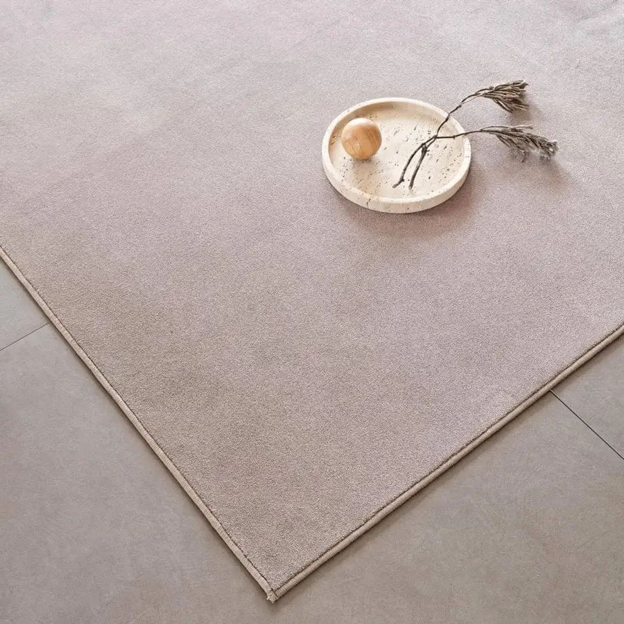 Sophisticated Cattelan Italia Kimi rug in muted beige-pink velvet with subtle geometric relief and semi-gloss appearance