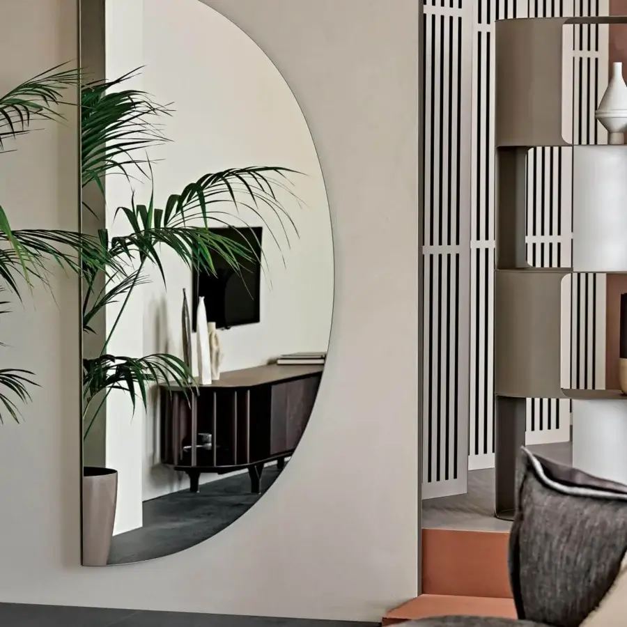Distinguished Cattelan Italia Day mirror crafted in mirrored glass with a refined semi-circular form and neutral toned frame