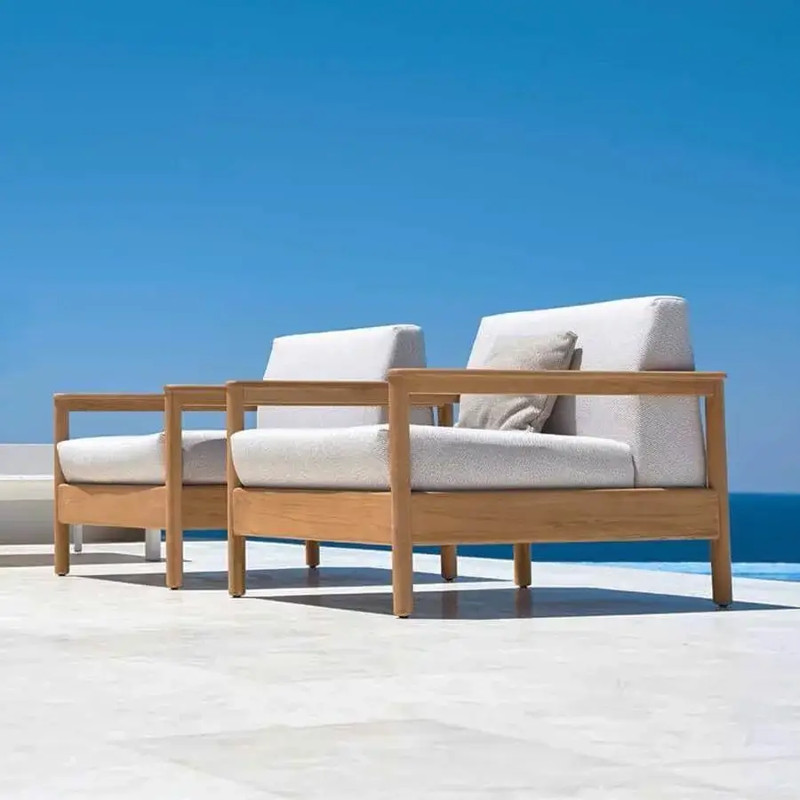 Sophisticated Varaschin Bali lounge chair with light Teak wood and neutral beige woven cushions crafted in Italy